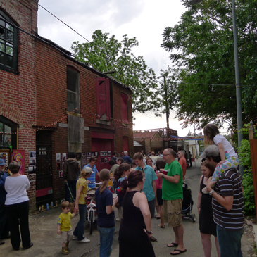 "Trinidad's Art in the Alley returns this Friday. The semi-annual community arts event includes works by neighborhood artists, libations and music. Pictured above Art in the Alley 2011. Photo by Phil Hutinet for East City Art"